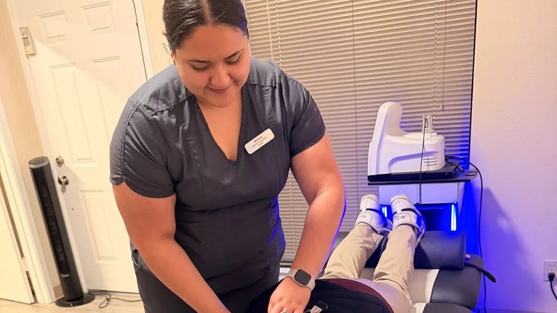 Denton Chiropractic Center staff performing spinal decompression therapy on a patient